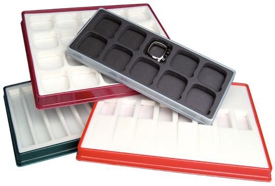 Plateaux thermoformés avec différentes mousses, faisant office de présentoir. Plateaux thermoformés avec différentes mousses, faisant office de présentoir.