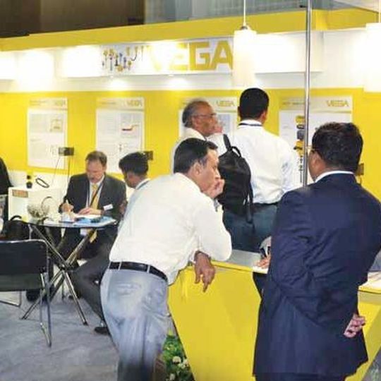 Visitors viewing innovative solution provided by multinational companies at the trade fair Visitors viewing innovative solution provided by multinational companies at the trade fair