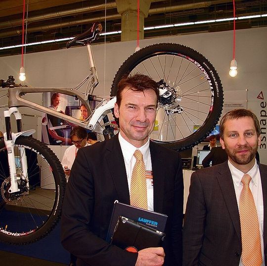 Renishaw's Albert Rundel (l.), product manager, and Robin Weston, marketing manager of the additive manufacturing products division, in front of the titanium frame the company developed with Empire Cycles. Renishaw's Albert Rundel (l.), product manager, and Robin Weston, marketing manager of the additive manufacturing products division, in front of the titanium frame the company developed with Empire Cycles.