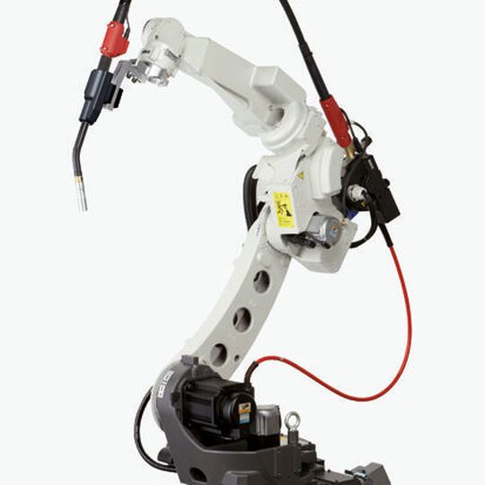 Ein Schweißroboter der TM-Serie mit extern montiertem Brennerschlauchpaket. Ein Schweißroboter der TM-Serie mit extern montiertem Brennerschlauchpaket.