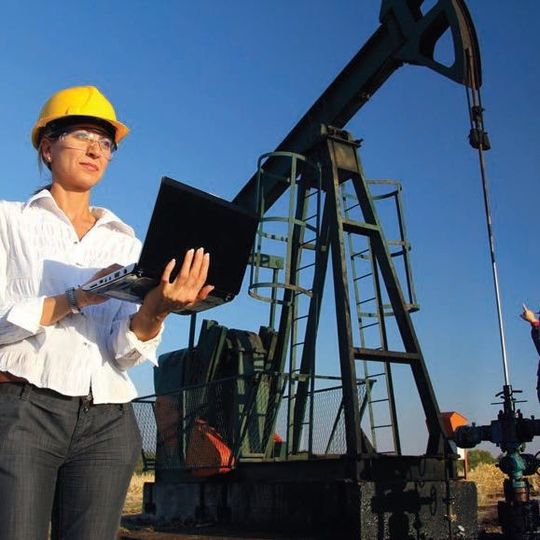 Operators recording characteristic measurement in an oil well. Operators recording characteristic measurement in an oil well.