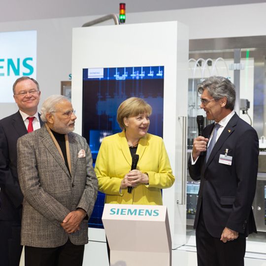 Modi and Merkel are seen along with Mr. Joe Kaeser, President and CEO, Siemens AG (second from right) and Klaus Helmrich, Member of the Managing Board of Siemens AG. Modi and Merkel are seen along with Mr. Joe Kaeser, President and CEO, Siemens AG (second from right) and Klaus Helmrich, Member of the Managing Board of Siemens AG.