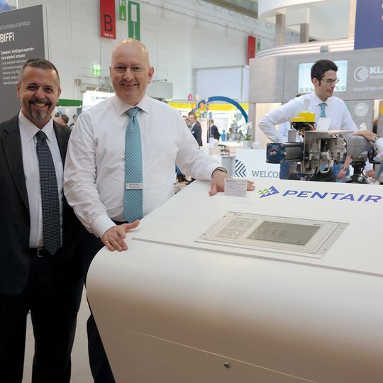 Pentair's Mario Pasquino (left) and Ugo Baldereschi (right) discuss the DCM2 remote actuator control system. Pentair's Mario Pasquino (left) and Ugo Baldereschi (right) discuss the DCM2 remote actuator control system.