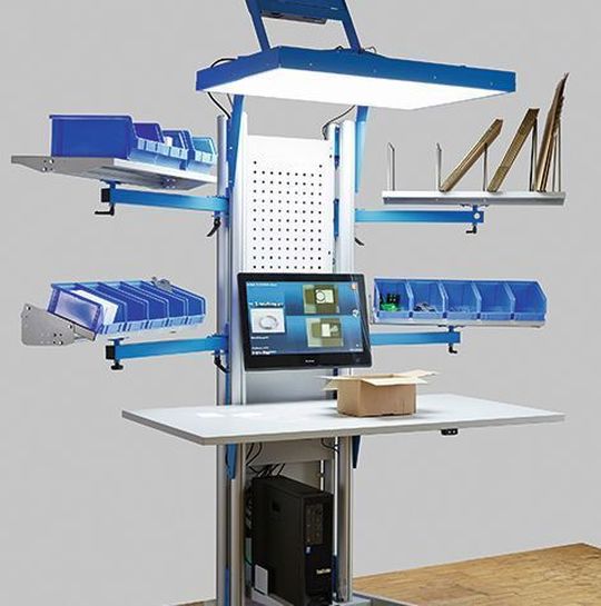 Der Arbeitsplatz 4.0, die Kombination eines ergonomischen Pack- und eines Montageplatzes, unterstützt den Logistikmitarbeiter über ein Bild auf der Arbeitsfläche und leitet ihn so zuverlässig an. Der Arbeitsplatz 4.0, die Kombination eines ergonomischen Pack- und eines Montageplatzes, unterstützt den Logistikmitarbeiter über ein Bild auf der Arbeitsfläche und leitet ihn so zuverlässig an.