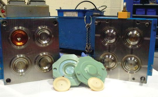 These functional prototype diaphragms were made with Santoprene using a 3D printed injection mold (foreground). The CNC tool previously used to create the same part is shown in the background. These functional prototype diaphragms were made with Santoprene using a 3D printed injection mold (foreground). The CNC tool previously used to create the same part is shown in the background.