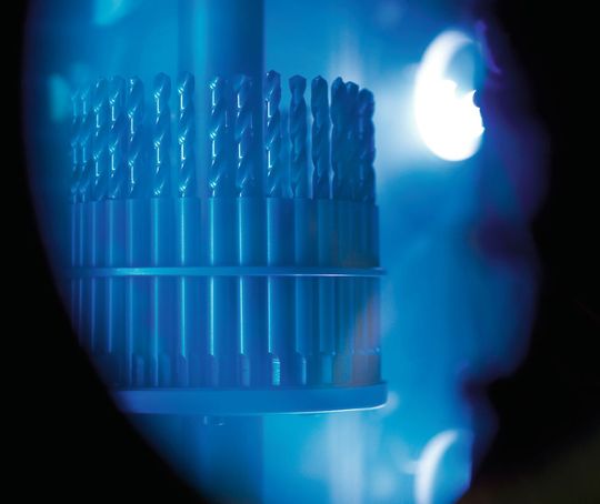 Tools during the production process in a vacuum chamber with plasma. Tools during the production process in a vacuum chamber with plasma.
