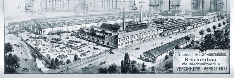Ein historischer Kupferstich zeigt das Werk der Siegener Verzinkerei Actiengesellschaft in Geisweid, Siegen im Jahre 1909. Im Hintergrund ist die Einmauerung des Verzinkungskessels dargestellt.
