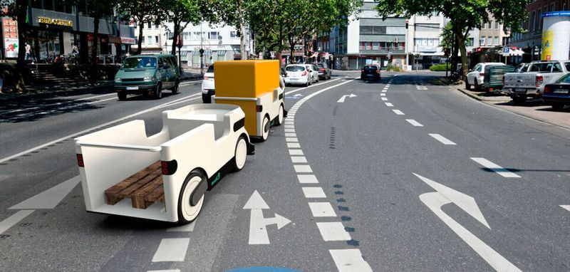 Die „Ducks“ sind vorerst auf maximal 25 km/h ausgelegt, fassen genau eine Europalette und transportieren problemlos 300 Kilogramm. Bis zu fünf Fahrzeuge können je Zug aneinander gekoppelt werden.
