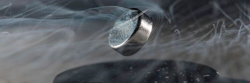 Currently, extreme cold is required to achieve superconductivity, as seen in the above photo from Dias’s lab. In the photo, a magnet can be seen floating above a superconductor cooled with liquid nitrogen.