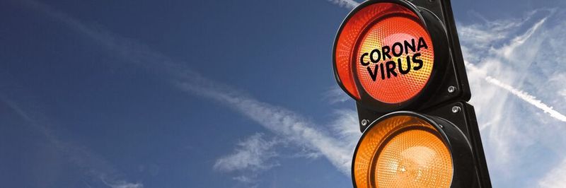 Corona-Ampel springt auf Rot: auf Betriebe in Bayern kommen nun neue Verpflichtungen zu.