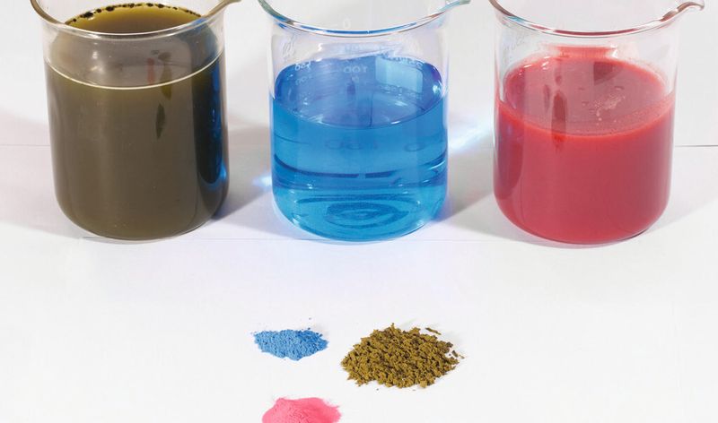 Repose piles show cranberry powder, copper solution for vitamins and chlorophyll powder — several of the powders produced by Summit Custom Spray Drying.