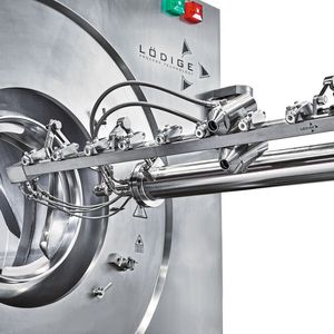 Coater with extended nozzle arm, view from below.(Source:  Gebr. Lödige Maschinenbau)