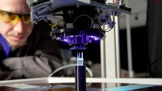 Here, a component for use in space is created from photopolymer by 3D printing. At Munich University of Applied Sciences, funding is now being provided to further develop this type of additive manufacturing so that it can produce in space. This saves not only money ... (Image:E. Krasnov / HM)