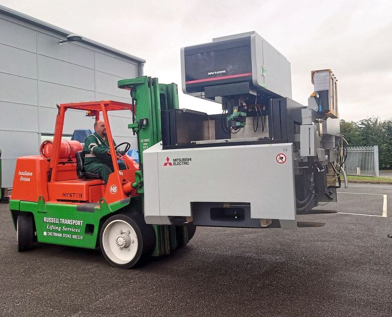 The Mitsubishi MV2400R being unloaded and delivered to EDM Precision.