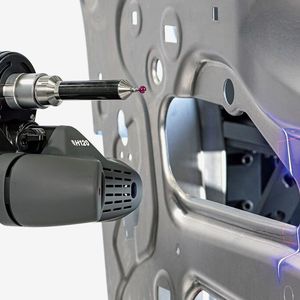An LK 7-axis Freedom measuring arm deploying an H120 laser scanner to inspect a car door.(Source:  LK Metrology)
