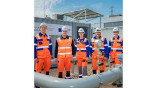 An dem Loop beteiligtes RWE-Team vor dem Teststand. (Bild: Helmut Kramer)