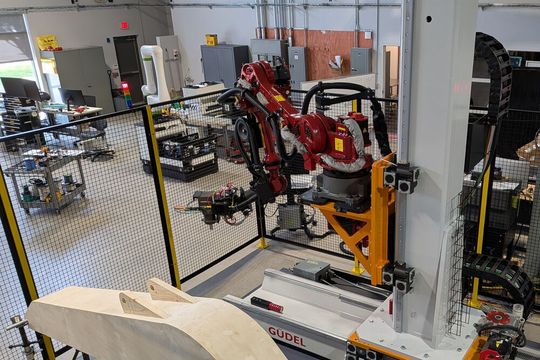 Güdel adds two additional degrees of freedom to heavy-duty robotic grinding applications through its Trackmotion Vertical (TMV) and Trackmotion Floor (TMF) systems. This allows a single robot to maintain consistent contact pressure and path speed across massive surfaces that would otherwise require multiple robots or complex part repositioning. (Source:  Titan Robotics)