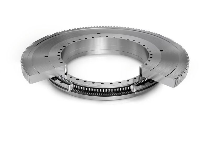 Genial einfach und patentiert: eine an das Rundachslager angearbeitete Verzahnung ersetzt das komplette Stirnrad des Getriebes zum Antrieb der Rundachse.  (Bild: Schaeffler)