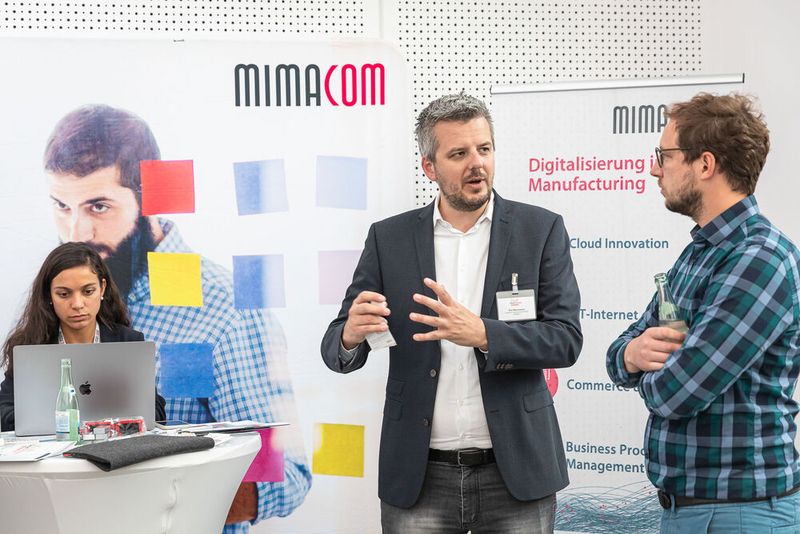 Tim Weinmann von Mimacom am Stand (Bild: Bausewein / PROCESS)
