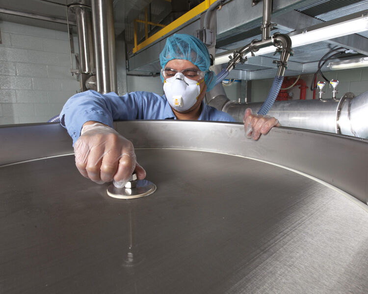 A Kason vibratory screener with circular 80 mesh (178 µm, 0.0070 in.) screen is inspected between production batches of fragrance powders. (Picture: Kason/Phil Degginger)