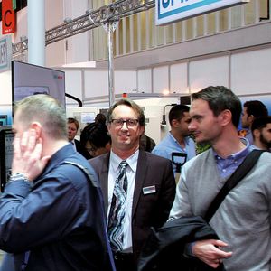 The calm in the storm: Greg Hyatt (c.) helped put DMG Mori in the quickly expanding field of additive manufacturing.