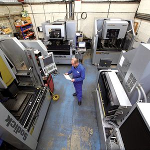 It’s all in a picture. A worker at the AJM shop surrounded by Sodick EDM units.