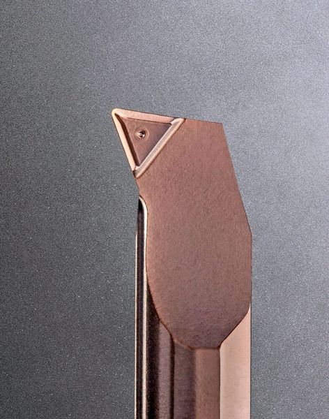 Close-up of the Supermini type 105 insert, showing the chip-breaker topology that is pressed into the green blank before sintering. (Source: Horn Cutting Tools)