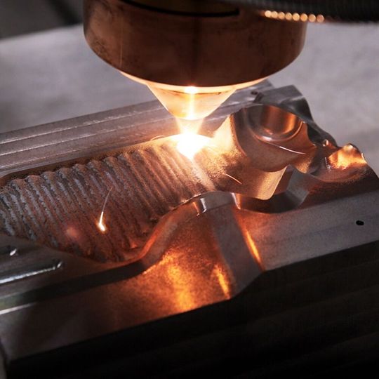 Tool and mold making can also benefit from laser cladding, as seen here. Damaged tool areas can be repaired efficiently and precisely by welding material and reshaping them to contour. The expensive component can then be reused.(Image:  Etxetar)
