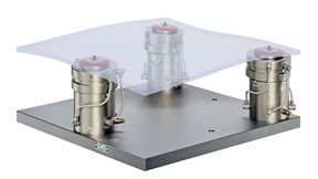 A Stark.spheric three-point workholding arrangement for supporting an irregularly shaped part, or one that has distorted after stresses have been released after initial machining. Clamping is effected by the Stark.spheric pedestals pulling down on threaded studs previously attached to the underside of the component (or its fixture). (Source: Roemheld)