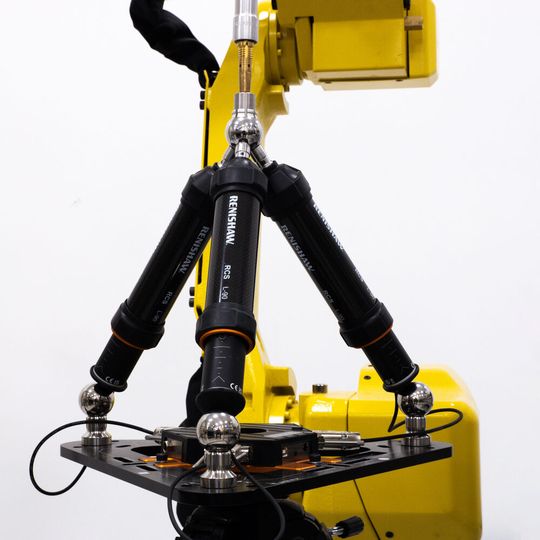 Renishaw's robotic diagnostic system for industrial automation, the RCS T-90, fitted within a working robot cell. Renishaw's robotic diagnostic system for industrial automation, the RCS T-90, fitted within a working robot cell.