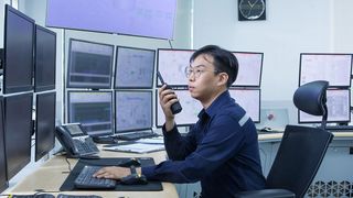 An operator monitors production in the control room.  (Wacker)