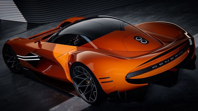 Die Endrohre der Abgasanlage befinden sich zwischen Fahrgastkabine und dem breiten Heckspoiler. (Bild: Genesis)