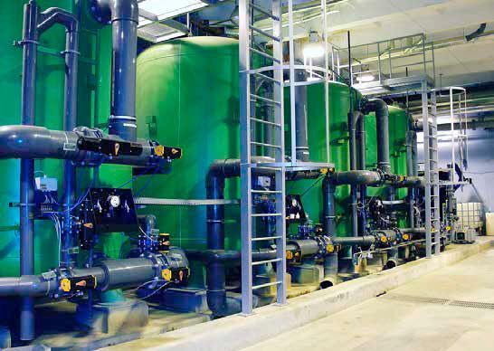 Water treatment tanks at a power plant. (depositphotos.com)